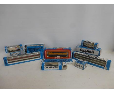 An assortment of Marklin HO 00 gauge trains, carriages and accessories including a Rio Grande 3062 engine, 4533, 4266, 4248, 
