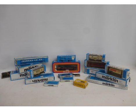 An assortment of Marklin HO 00 gauge trains, carriages and accessories including a South Pacific 3129 engine, 4087, 4627, 453