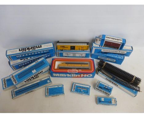 An assortment of Marklin HO 00 gauge trains, carriages and accessories including a Rio Grande 4062 engine, 4052, 4089, 4773, 