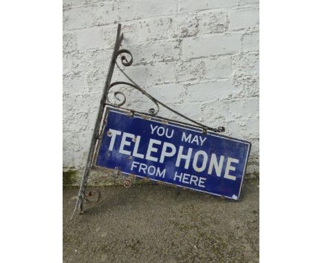 A "You May Telephone From Here" rectangular double sided enamel sign with original metal bracket, 22 x 9" (sign only).