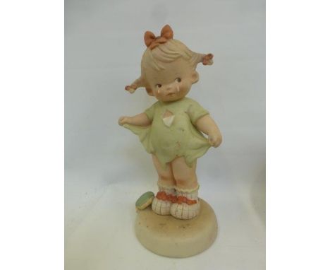 A 1987 Lucie Attwell Ltd. Memories of Yesterday, "Mommy I teared It" ceramic figurine.