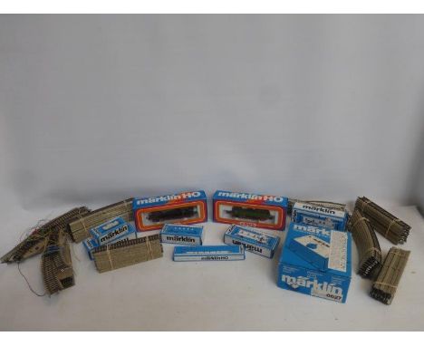 An assortment of Marklin HO 00 gauge trains, carriages and accessories including a 3312 engine, a 3096 engine, 4777, 4775, 25