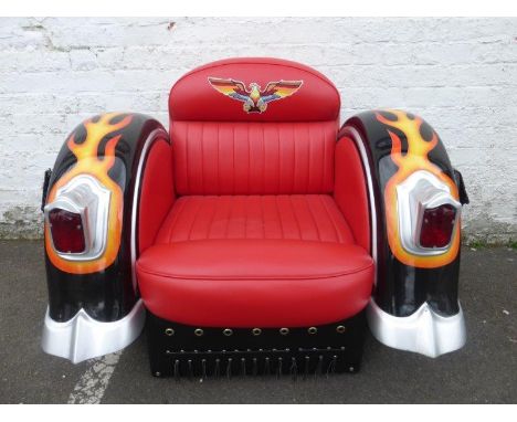 A Yab Design Harley Davidson style leather motorbike armchair with working lights, side panniers and back pockets.