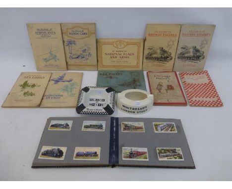 A Mintons Whitbread's Pale Ale ashtray, a Black & White Scotch whisky ashtray and an assortment of cigarette collector's card