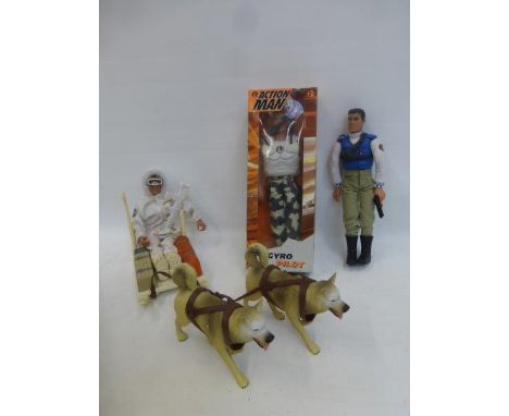 A boxed Action Man - Gyro Pilot, a Strikeforce Action Man with sledge and dog team and a police Action Man.