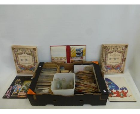A box of mixed collectables including stamps, bottles, playing cards, postcards etc.
