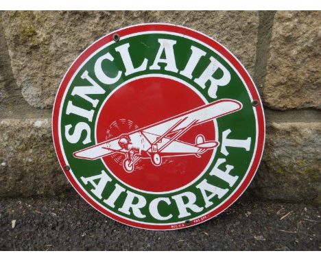 A small American circular enamel sign advertising Sinclair Aircraft, 11 1/4" diameter.
