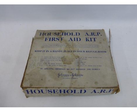A household A.R.P. First Aid Kit conforming to Home Office specifications by Johnson & Johnson - with contents.
