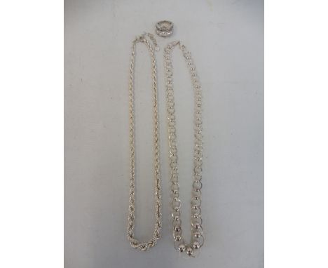 Two silver necklaces and a silver ring.