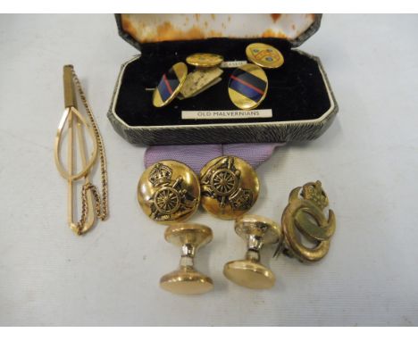 A cased pair of Old Malvernians part enamel cufflinks, another pair of yellow metal cufflinks and two brooches etc.
