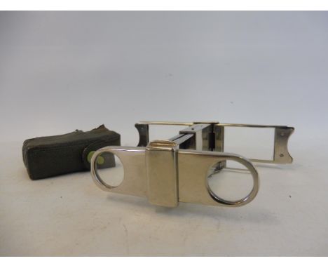 A very good quality silver plated pair of travelling folding binoculars, of skeleton form, by Curry &amp; Paxton Ltd, London.