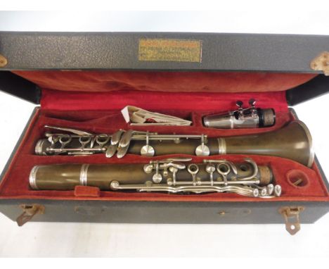 A Commodore clarinet with white metal keys, number 42797, in a fitted case.