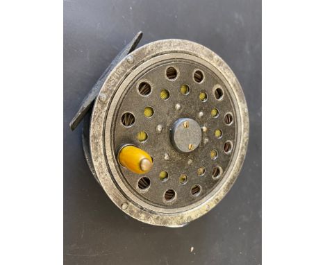 A Pflueger Medalist centre pin fishing reel.