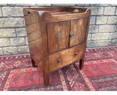 A 19th Century mahogany tray top bedside commode with panelled doors above a drawer (converted), 23" w.
