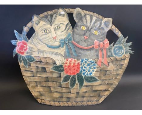 A toleware fire screen in the form of two cats in a basket of flowers, 28" wide.&nbsp;