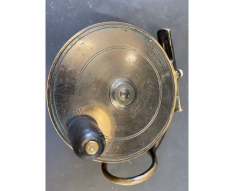 A Malloch Patent brass 3 7/8" side caster fishing reel.