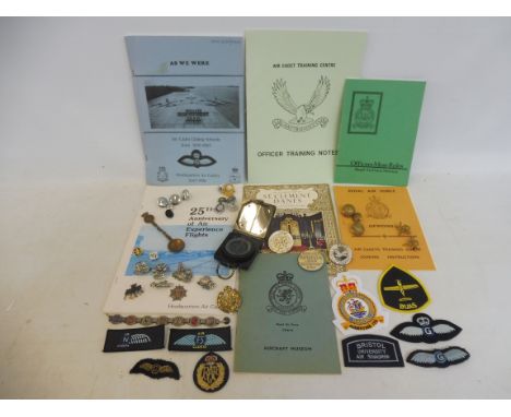A collection of interesting RAF badges and insignia, military ephemera, a compass plus badges etc.
