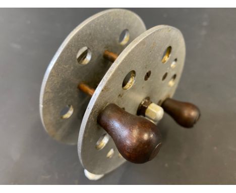 An early Milbro 3 3/8" aluminium centre pin fishing reel.