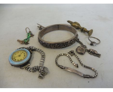 A silver and blue enamel cased ladies wristwatch, a silver and enamel duck pendant, a brass seal and various other jewellery.