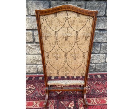 A 19th Century kingwood and tulipwood fire screen, probably French, with an upholstered panel, 16 1/2" w.