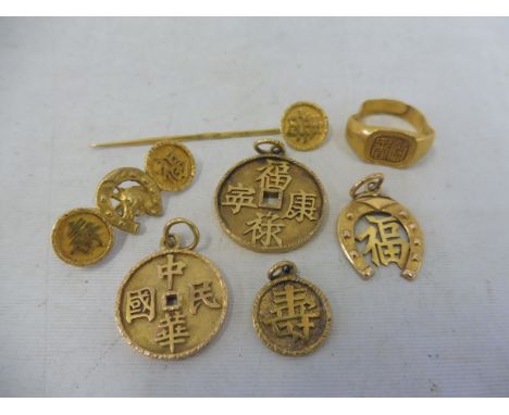 A selection of Oriental yellow metal jewellery, probably 18ct gold, including pendants, a ring etc. weighs approx. 20.9g.