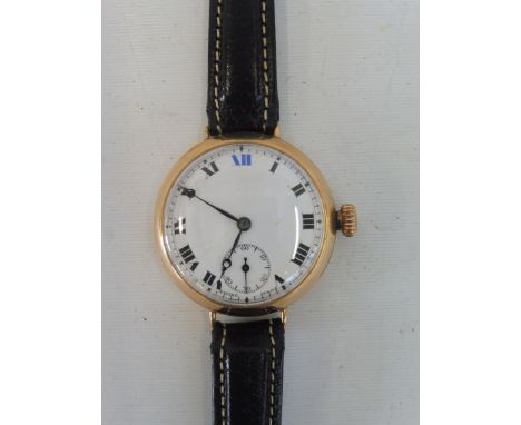 A 9ct gold cased wristwatch with a white enamel dial, modern leather strap, approx. weight overall 27.8g.