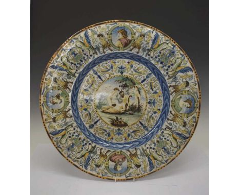 Large 19th Century Italian maiolica charger the centre painted with four figures, one horned (possibly a scene of Moses strik