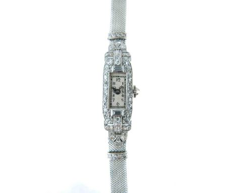 Lady's Art Deco white metal cased cocktail bracelet watch, the unmarked case with multi-set diamonds, the rectangular white d