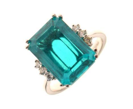 Emerald and diamond ring, the step cut stone approximately 15.1mm x 10.9mm x 6.5mm deep, with a trio of small brilliant cuts 