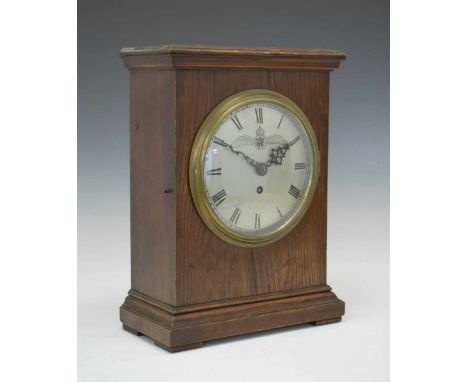 World War II-era RAF 'Officer's Mess' oak-cased bracket or mantel clock, the 19cm silvered Roman dial engraved with RAF winge