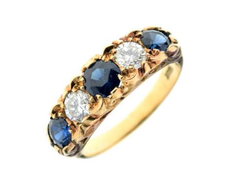 Yellow metal, sapphire and diamond five stone ring, the carved head mount stamped '18ct', the two brilliant cut diamonds tota