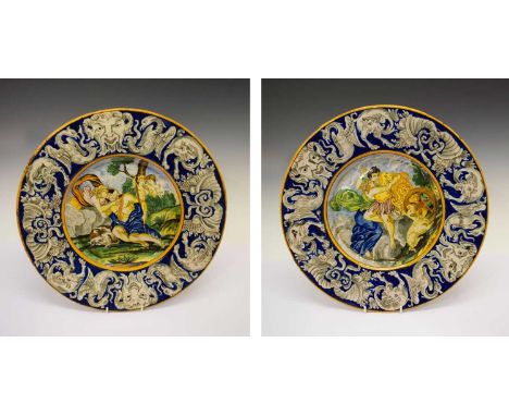 Pair of Italian maiolica chargers, early 20th Century, the first depicting Diana awakening Endymion, the other possibly the F