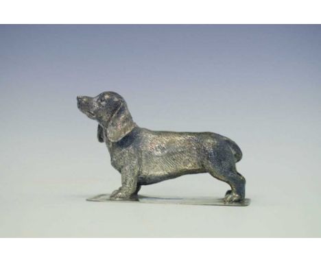 Elizabeth II Scottish cast solid silver model of a Dachshund on a flat base, sponsor's mark of P.S., Edinburgh 2004, 7cm high