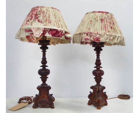 TABLE LAMPS, a pair, altar candlestick form with trefoil carved bases in a painted dark gilt finish, each overall 70cm H incl