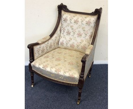 A Continental tapestry back armchair with scroll arms. Est. £40 - £60.