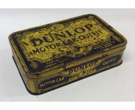 A "Dunlop Motor Car Outfit" tin. (1).