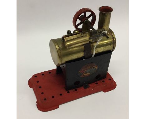 A Mamod steam engine on red base with burner. Est. £30 - £40.