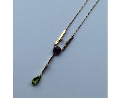SUFFRAGETTE: A large 15 carat amethyst, peridot and pearl necklace on fine link chain. Approx. 7 grams. Est. £500 - £800.