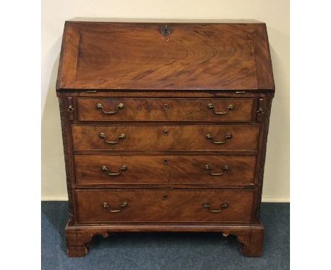 A Georgian mahogany bureau with fall front and bracket feet. Est. £60 - £80.