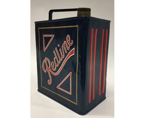 A "Redline" fuel can. (1).