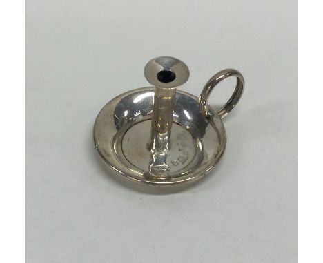 A good miniature silver chamber stick. Birmingham. By GY. Approx. 8 grams. Est. £40 - £60.