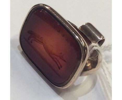 A large gold mounted intaglio seal. Approx. 18 grams. Est. £25 - £35.