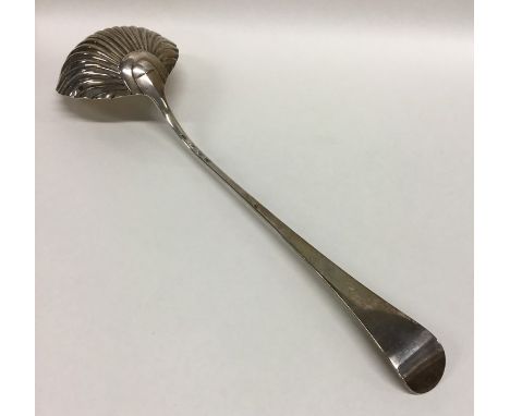 An early Georgian silver ladle with reeded bowl. London. By IM. Approx. 100 grams. Est. £150 - £200.