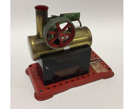 A Mamod steam engine on red base with burner. Est. £30 - £40.
