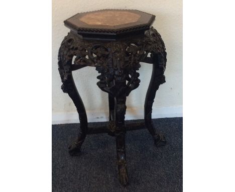 A good quality carved Chinese planter with marble inset. Est. £150 - £200.