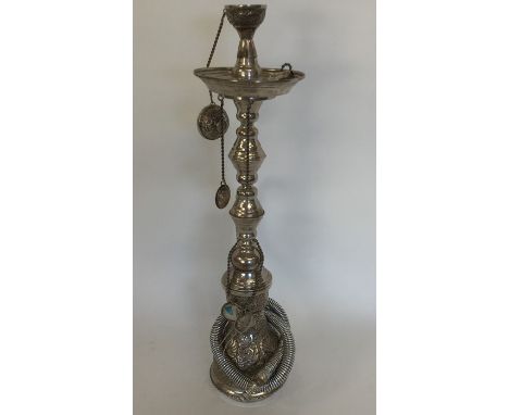 A massive Continental silver bubble pipe attractively decorated with flowers and scrolls and twisted stem. Approx. 1140 grams