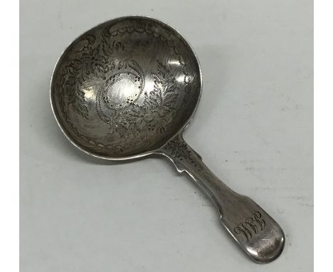 A good Georgian bright cut caddy spoon with fiddle pattern handle. Approx. 9 grams. Est. £30 - £50.