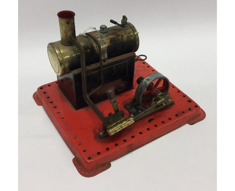 A Mamod steam engine on red base with burner. Est. £40 - £50.