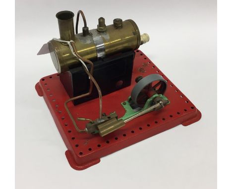 A Mamod steam engine on red base with burner. Est. £40 - £50.