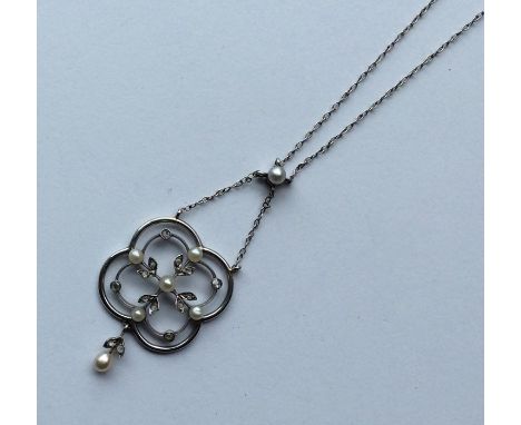 An attractive pearl pendant decorated with diamonds on fine link chain. Approx. 7 grams. Est. £300 - £400.